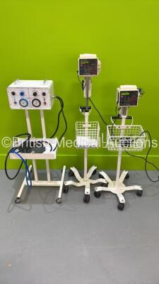 2 x CSI Criticare 506DXNT Vital Signs Monitors with Power Supplies on Stands (Both Power Up) and 1 x Anetic Aid APT.MK.2 Tourniquet on Stand with Hoses