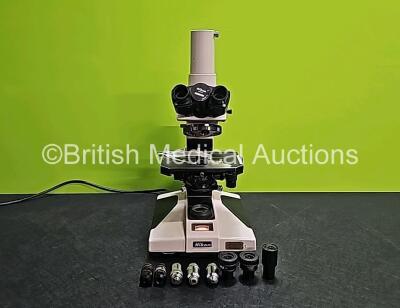 Nikon OPTIPHOT Benchtop Microscope with 2 x CFW 10x Eyepieces, 1 x CF Photo 5x Eyepiece, 1 x Lietz Wetzlar *160/0.17 NPL Fluotar 40/0.70 Optic, 1 x Nikon Plan Apo 20 0.65 160/0.17 Optic, 1 x Nikon Plan Apo 10 0.4 160/0.17 Optic, 1 x Nikon Plan Apo 4 0.16