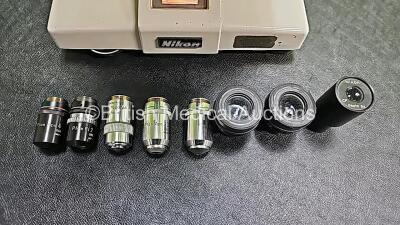 Nikon OPTIPHOT Benchtop Microscope with 2 x CFW 10x Eyepieces, 1 x CF Photo 5x Eyepiece, 1 x Lietz Wetzlar *160/0.17 NPL Fluotar 40/0.70 Optic, 1 x Nikon Plan Apo 20 0.65 160/0.17 Optic, 1 x Nikon Plan Apo 10 0.4 160/0.17 Optic, 1 x Nikon Plan Apo 4 0.16 - 3