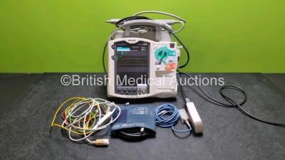 Philips Heartstart MRx Defibrillator (Powers Up) Including Pacer ,ECG, SpO2 NIBP, C02 and Printer Options with External Paddle Dock with External Hard Paddles, 1 x Paddle Lead, 1 x 3 Lead ECG Lead, 1 x Philips M3725A Test Load, 1 x Philips M3538A Battery