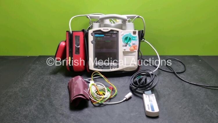 Philips Heartstart MRx Defibrillator (Powers Up) Including Pacer ,ECG, SpO2 NIBP and Printer Options with External Paddle Dock with External Hard Paddles, 1 x Paddle Lead, 1 x 3 Lead ECG Lead, 1 x Philips M3725A Test Load, 1 x Philips M3538A Battery and 1