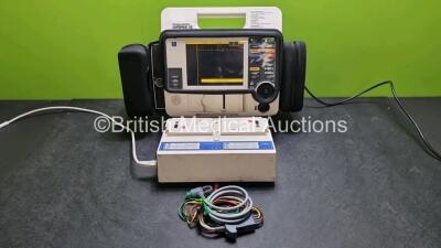 Medtronic Lifepak 12 Biphasic Defibrillator / Monitor Including Pacer, ECG and Printer Options (Powers Up) with 2 x Batteries, 3 Lead ECG Lead and Mobile Battery Service Station (Powers Up) with 2 x Batteries