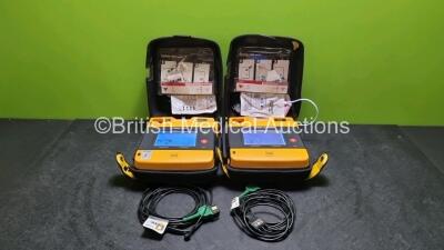 2 x Medtronic Physio Control Lifepak 1000 Defibrillators *Mfd - 2011 / 2014* (Both Power Up Both with Slight Crack In Casing - See Photos)