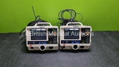 2 x Physio Control Medtronic Lifepak 20e Defibrillators / Monitors *Mfd - 2015* (Both Power Up, Both Missing Doors) Including Pacer, ECG and Printer Options with 2 x Paddle Leads and 2 x 3 Lead ECG Leads *SN 44183955 / 44E185937*