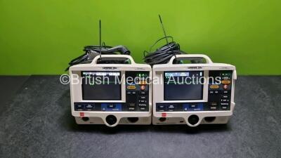 2 x Physio Control Medtronic Lifepak 20e Defibrillators / Monitors *Mfd - 2015* (Both Power Up, Both Missing Doors) Including Pacer, ECG and Printer Options with 2 x Paddle Leads and 2 x 3 Lead ECG Leads *SN 44184563 / 43291011*