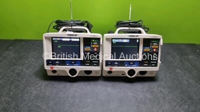 2 x Physio Control Medtronic Lifepak 20e Defibrillators / Monitors *Mfd - 2015* (Both Power Up, Both Missing Doors, Slight Damage to Casing - See Photo) Including Pacer, ECG and Printer Options with 2 x Paddle Leads and 2 x 3 Lead ECG Leads *SN 44186298 