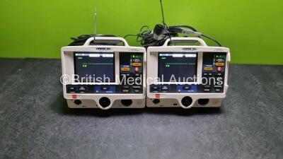 2 x Physio Control Medtronic Lifepak 20e Defibrillators / Monitors *Mfd - 2015* (Both Power Up, Both Missing Doors) Including Pacer, ECG and Printer Options with 2 x Paddle Leads and 2 x 3 Lead ECG Leads *SN 44186215 / 44188160*