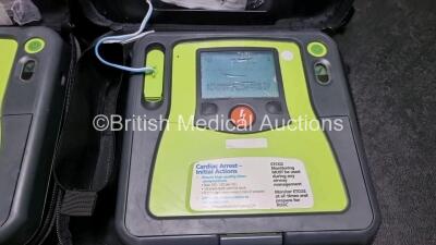 2 x Zoll AED PRO Defibrillators (Both Power Up, Both with Scratches On Screen - See Photo) In Carry Case with 2 x 3 Lead ECG Leads, 2 x Batteries and 2 x In Date Electrode Packs - 2