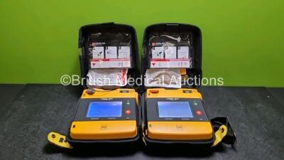 2 x Medtronic Physio Control Lifepak 1000 Defibrillators *Mfd 2014 / 2015* (Both Power Up) In Case with 2 x Batteries *Install Before - 2023 / 2025*