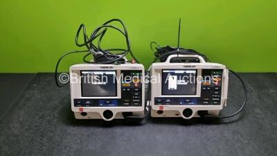 2 x Physio Control Medtronic Lifepak 20e Defibrillators / Monitors *Mfd - 2017 / 2015* (Both Power Up) Including Pacer, ECG and Printer Options with 2 x Paddle Leads and 2 x 3 Lead ECG Leads