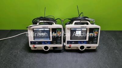 2 x Physio Control Medtronic Lifepak 20e Defibrillators / Monitors *Mfd - 2015* (Both Power Up, 1 x Missing Door) Including ECG and Printer Options with 2 x Paddle Leads