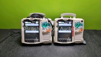 2 x Philips Heartstart MRx Defibrillators (Both Power Up) Including Pacer and ECG Options with 2 x Paddle Lead *SN US00579314 / US0084758*