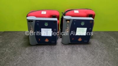 2 x Philips FR2+ Plus Defibrillators (Both Power Up) in Case with 2 x Batteries