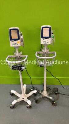 2 x Welch Allyn SPOT Vital Signs LXi Vital Signs Monitors with Power Supplies on Stands (Both Power Up) *20120302287*