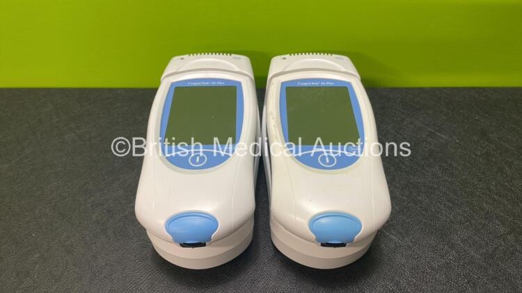 2 x Roche CoaguChek XS Plus Meters with 2 x Docking Stations (Untested Due to No Power Supply and Missing Batteries)