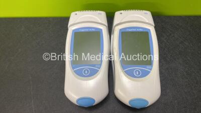 2 x Roche CoaguChek XS Plus Meters with 2 x Docking Stations (Untested Due to No Power Supply and Missing Batteries) - 2