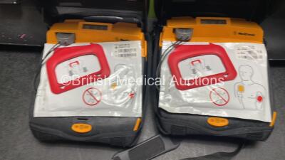 2 x Medtronic Lifepak CR Plus Defibrillators (Both Power Up) with 2 x Electrode Packs *Both Expired* in Carry Cases and 2 x Medtronic Mounting Brackets - 5