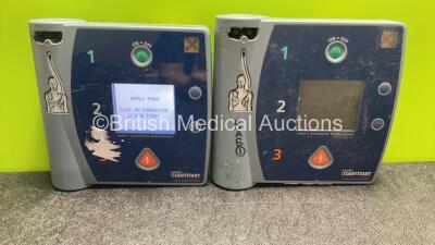 2 x Laerdal Heartstart FR2 Defibrillators with 1 x Philips M3863A Battery(1 Powers Up, 1 No Power)