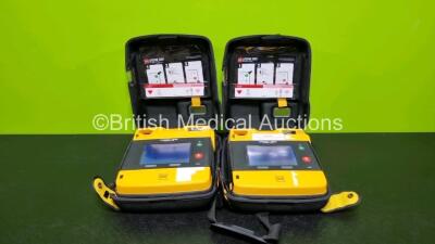 2 x Medtronic Physio Control Lifepak 1000 Defibrillators *Mfd 2014* (Both Power Up with Stock Battery Stock Battery Not Included) In Case