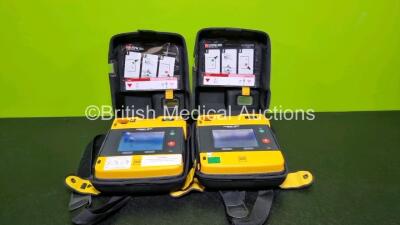 2 x Medtronic Physio Control Lifepak 1000 Defibrillators *Mfd 2014* (Both Power Up with Stock Battery Stock Battery Not Included) In Case