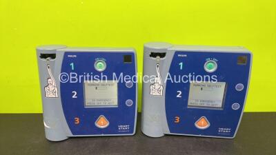 2 x Philips FR2+ Plus Defibrillators (Both Power Up and Pass Self Test with Stock Batteries, Batteries Not Included)