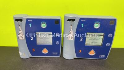 2 x Philips FR2+ Plus Defibrillators (Both Power Up and Pass Self Test with Stock Batteries, Batteries Not Included)