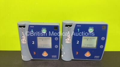 2 x Philips FR2+ Plus Defibrillators (Both Power Up and Pass Self Test with Stock Batteries, Batteries Not Included)