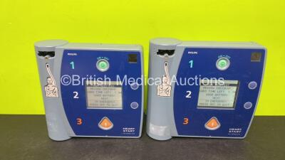 2 x Philips FR2+ Plus Defibrillators (Both Power Up and Pass Self Test with Stock Batteries, Batteries Not Included)