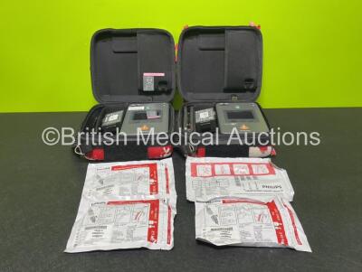 2 x Philips FR3 Defibrillators (Both Power Up with Low Battery) with 4 x Batteries *Install Before 2024 / 2027 / 2025 / 2026* and 4 x Electrode Packs (All Expired) in Cases