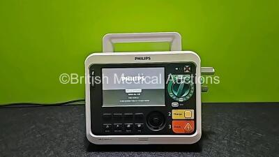 Philips Efficia DFM100 Defibrillator *Mfd 2018* Including Pacer, ECG and Printer Options Release Rev 2.0 with 1 x Battery (Powers Up and Missing Paddle Lead Connector Cap - See Photo)