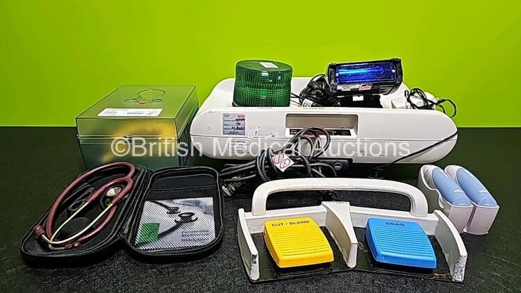 Mixed Lot Including 1 x Verathon BladderScan BVI9000 Series Calibration Tank, 1 x Seca Weighing Scale, 1 x Welch Allyn Stethoscope, 1 x ConMed Footswitch, 2x Braun ThermoScan Thermometers, 1 x Green Emergency 12v Light and 1 x Blue Emergency 12v Light