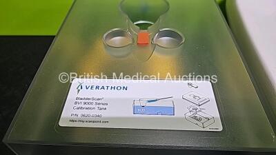 Mixed Lot Including 1 x Verathon BladderScan BVI9000 Series Calibration Tank, 1 x Seca Weighing Scale, 1 x Welch Allyn Stethoscope, 1 x ConMed Footswitch, 2x Braun ThermoScan Thermometers, 1 x Green Emergency 12v Light and 1 x Blue Emergency 12v Light - 3