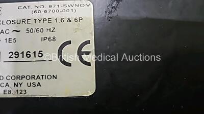 Mixed Lot Including 1 x Verathon BladderScan BVI9000 Series Calibration Tank, 1 x Seca Weighing Scale, 1 x Welch Allyn Stethoscope, 1 x ConMed Footswitch, 2x Braun ThermoScan Thermometers, 1 x Green Emergency 12v Light and 1 x Blue Emergency 12v Light - 12