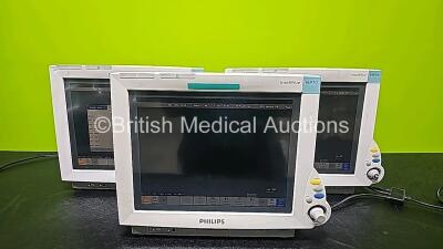 3 x Philips IntelliVue MP70 Patient Monitors (All Power Up and 2 x Missing Dials - See Photo) *SN DE84381729 / DE84381775 / DE84381781*