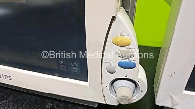 Job Lot Including 2 x Philips IntelliVue MP70 Patient Monitors (Both Power Up, Both Damaged Cases and 1 x Missing Dial - See Photos), 1 x Philips IntelliVue MP30 Touch Screen Patient Monitor (Powers Up, Missing Battery Door and Damaged Case - See Photos) - 14