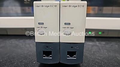 4 x Philips IntelliVue MP70 Patient Monitors with 2 x Philips IntelliBridge EC10 Modules (All Power Up, 1 x Cracked Case and 1 x Missing Dial - See Photo) *SN DE84381763 / DE73165265 / DE84381769 / DE35015194* - 5