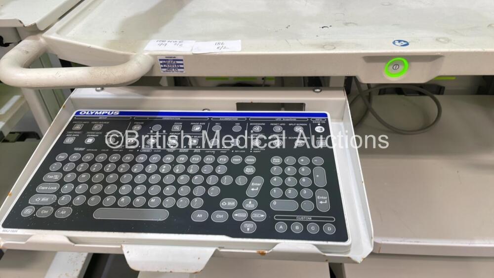 2 x Olympus Stack Trolleys Including Olympus MAJ-1924 Keyboard ...
