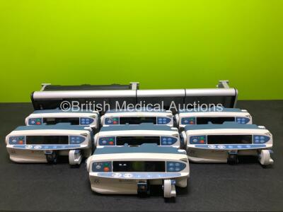 7 x CareFusion Alaris CC Syringe Pumps with 1 x Alaris Gateway Workstation (1 x Crack in Casing, 1 x Crack in Screen - See Photos) *SN 800356447 / 800356553 / 800305341 / 800354177 / 800354210 / 800356444 / 800356470*