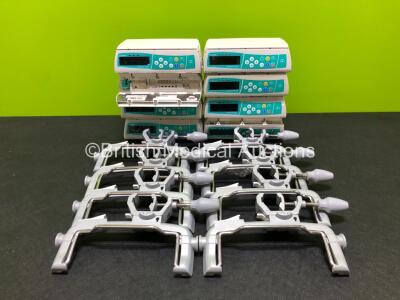 8 x B.Braun Infusomat Space Infusion Pumps with 4 x Power Supplies and 8 x Pole Clamps (7 x Power Up, 2 x with Alarm, 1 x Draws Power) *RI*