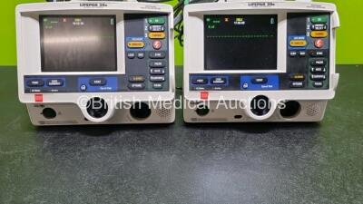 2 x Lifepak 20e Defibrillators / Monitors *Mfd - 2015* (Both Power Up) Including Pacer, ECG and Printer Options with 2 x 3 Lead ECG Leads and 2 x Paddle Leads *SN 43293062 / 43291387* - 6