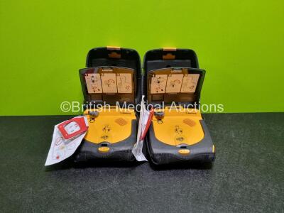 2 x Medtronic Lifepak CR Plus Defibrillators (Both Power Up) in Carry Cases and 2 x Medtronic Mounting Brackets - 2