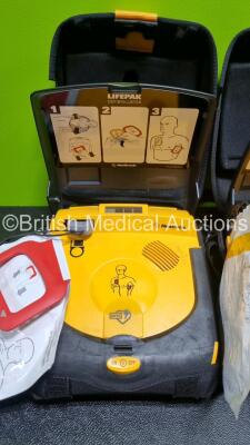 2 x Medtronic Lifepak CR Plus Defibrillators (Both Power Up) in Carry Cases and 2 x Medtronic Mounting Brackets - 4