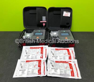 2 x Philips Heartstart FR3 Defibrillators (Both Power Up) in Carry Cases with 4 x Electrode Packs *2 in Date, 2 Expired* and 4 x Batteries *Install Before - 2026 / 2027 / 2028 / 2028* **SN C18G-00800 / C18G-00831**