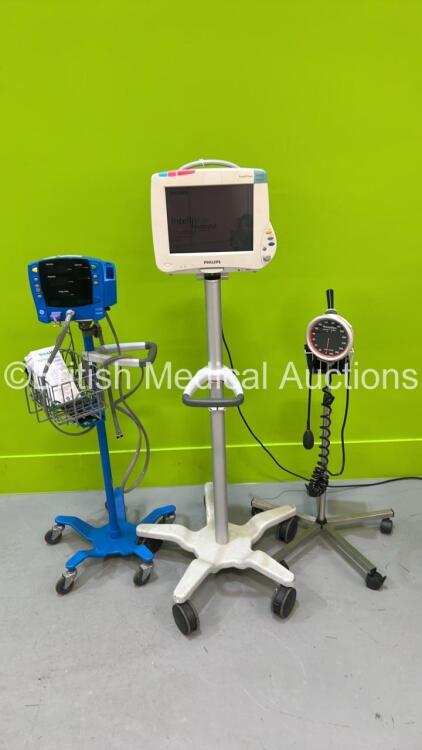 1 x Philips Intellivue MP50 Anaesthesia Monitor on Stand, 1 x GE Carescape V100 Vital Signs Monitor on Stand and 1 x Blood Pressure Meter on Stand (Both Power Up) *S/N DE44014429 / SDT08410201SP*