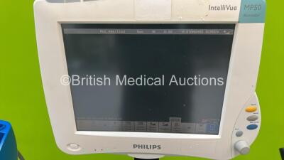 1 x Philips Intellivue MP50 Anaesthesia Monitor on Stand, 1 x GE Carescape V100 Vital Signs Monitor on Stand and 1 x Blood Pressure Meter on Stand (Both Power Up) *S/N DE44014429 / SDT08410201SP* - 2