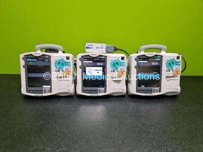3 x Philips Heartstart MRx Defibrillators (All Power Up) Including Pacer ,ECG and Printer Options with 1 x Philips M3725A Test Load, 3 x Philips M3539A Modules and 3 x