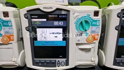 3 x Philips Heartstart MRx Defibrillators (All Power Up) Including Pacer ,ECG and Printer Options with 1 x Philips M3725A Test Load, 3 x Philips M3539A Modules and 3 x - 3