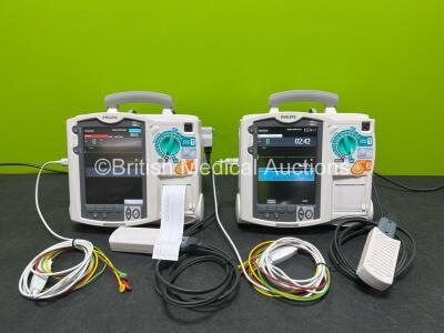 2 x Philips Heartstart MRx Defibrillators (Both Power Up) Including ECG and Printer Options, 2 x Paddle Leads, 2 x Test Loads, 2 x 3 Lead ECG Leads, 2 x Philips M3539A Modules and 2 x Philips M3538A Li-Ion Batteries *SN US00583348 / US00583344*