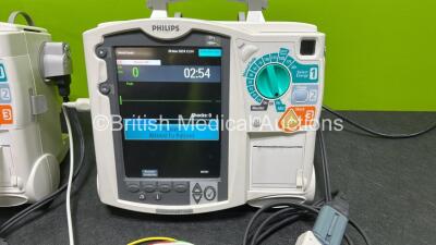 2 x Philips Heartstart MRx Defibrillators (Both Power Up) Including ECG and Printer Options, 2 x Paddle Leads, 2 x Test Loads, 2 x 3 Lead ECG Leads, 2 x Philips M3539A Modules and 2 x Philips M3538A Li-Ion Batteries *SN US00583348 / US00583344* - 2