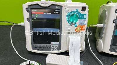 2 x Philips Heartstart MRx Defibrillators (Both Power Up) Including ECG and Printer Options, 2 x Paddle Leads, 2 x Test Loads, 2 x 3 Lead ECG Leads, 2 x Philips M3539A Modules and 2 x Philips M3538A Li-Ion Batteries *SN US00583348 / US00583344* - 3